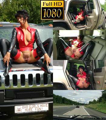 Horny bizarre in rubber with the truck on the road